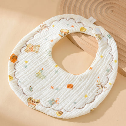 WhisperSoft™ cotton bib featuring a white background with colorful animal and toy illustrations.
