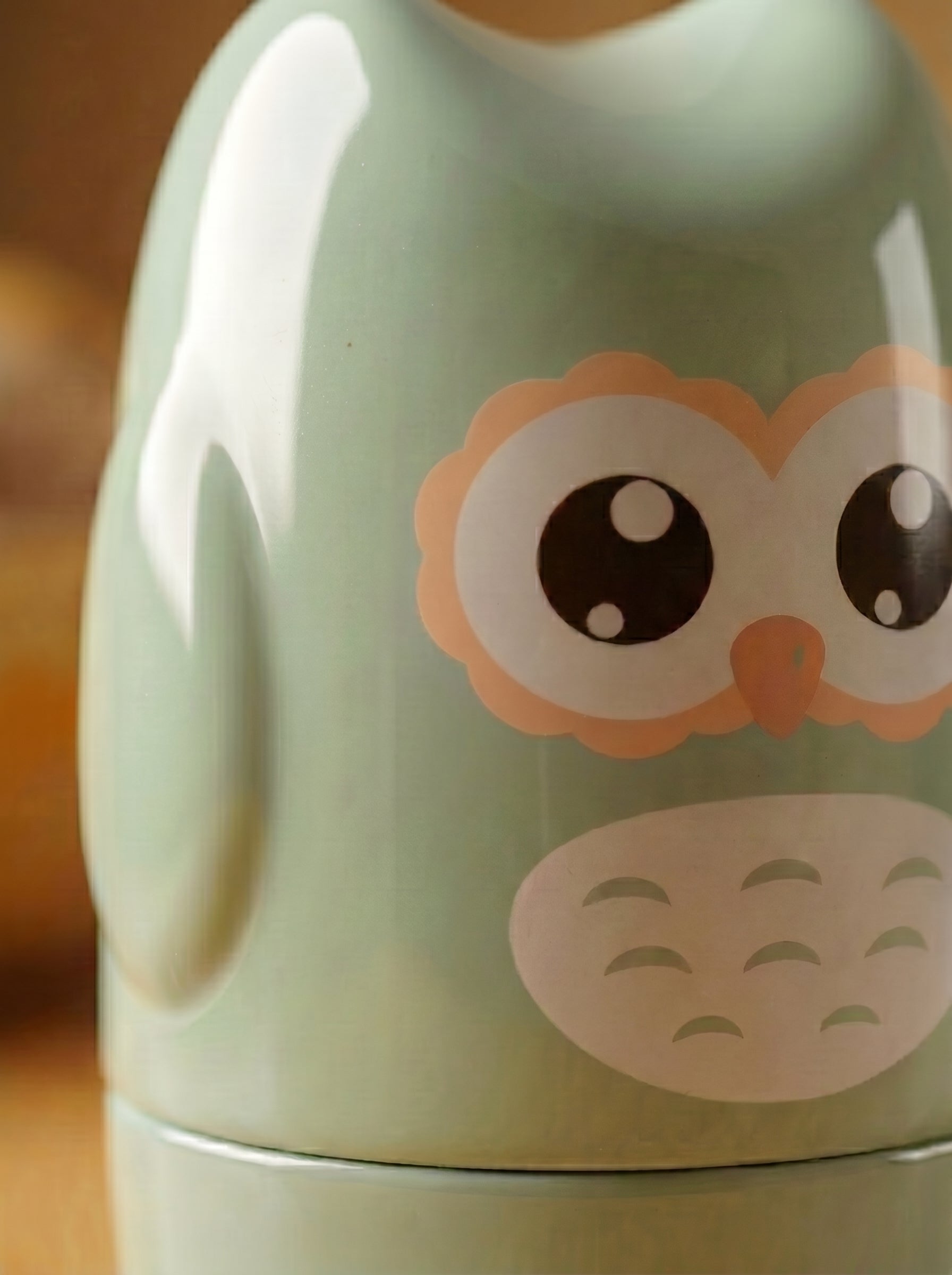WhisperCare™ Baby Care Kit in a green owl-shaped case with large eyes and a patterned belly.