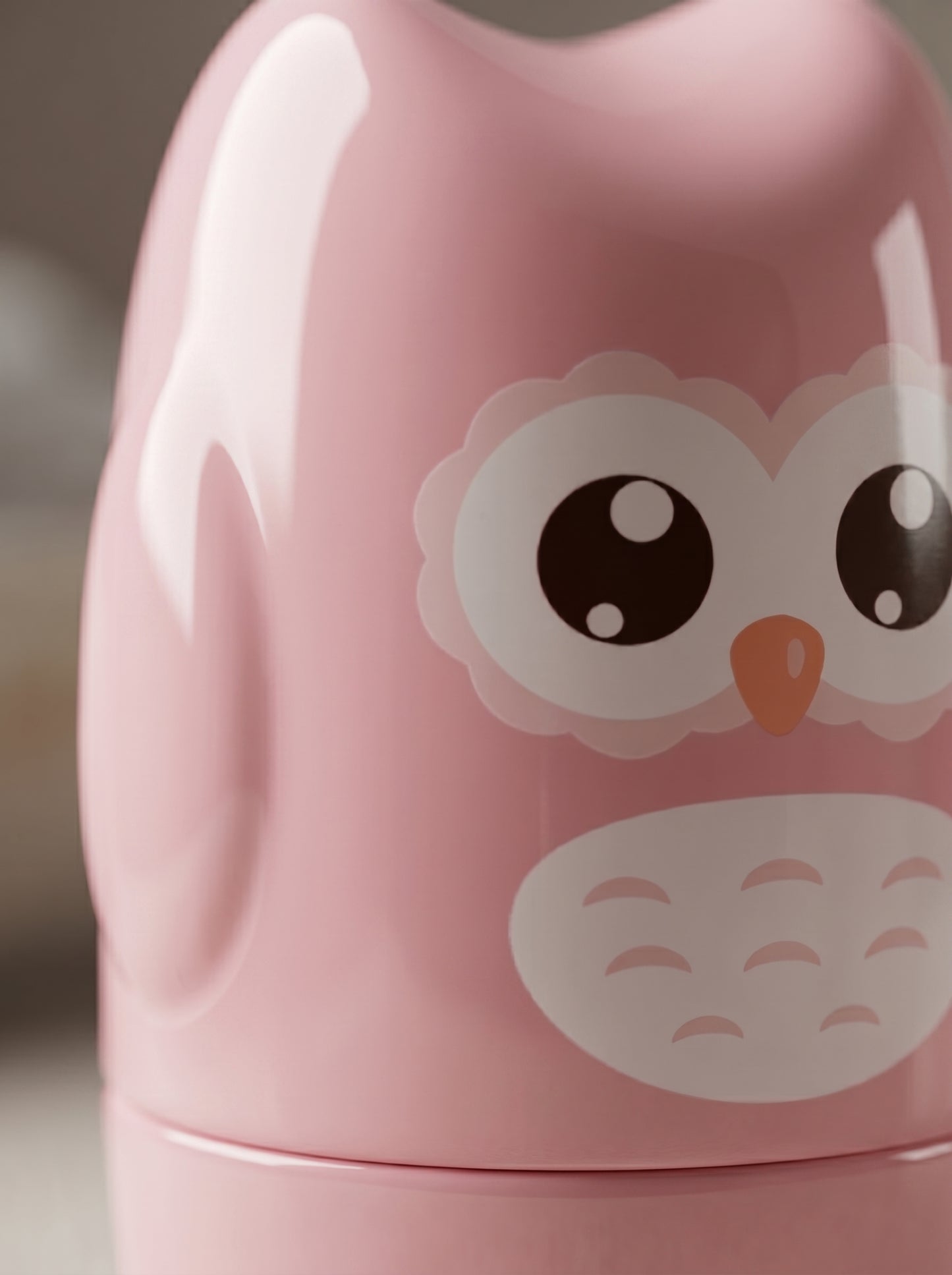 WhisperCare™ baby care kit in a pink owl-shaped case with large eyes and a white belly design.