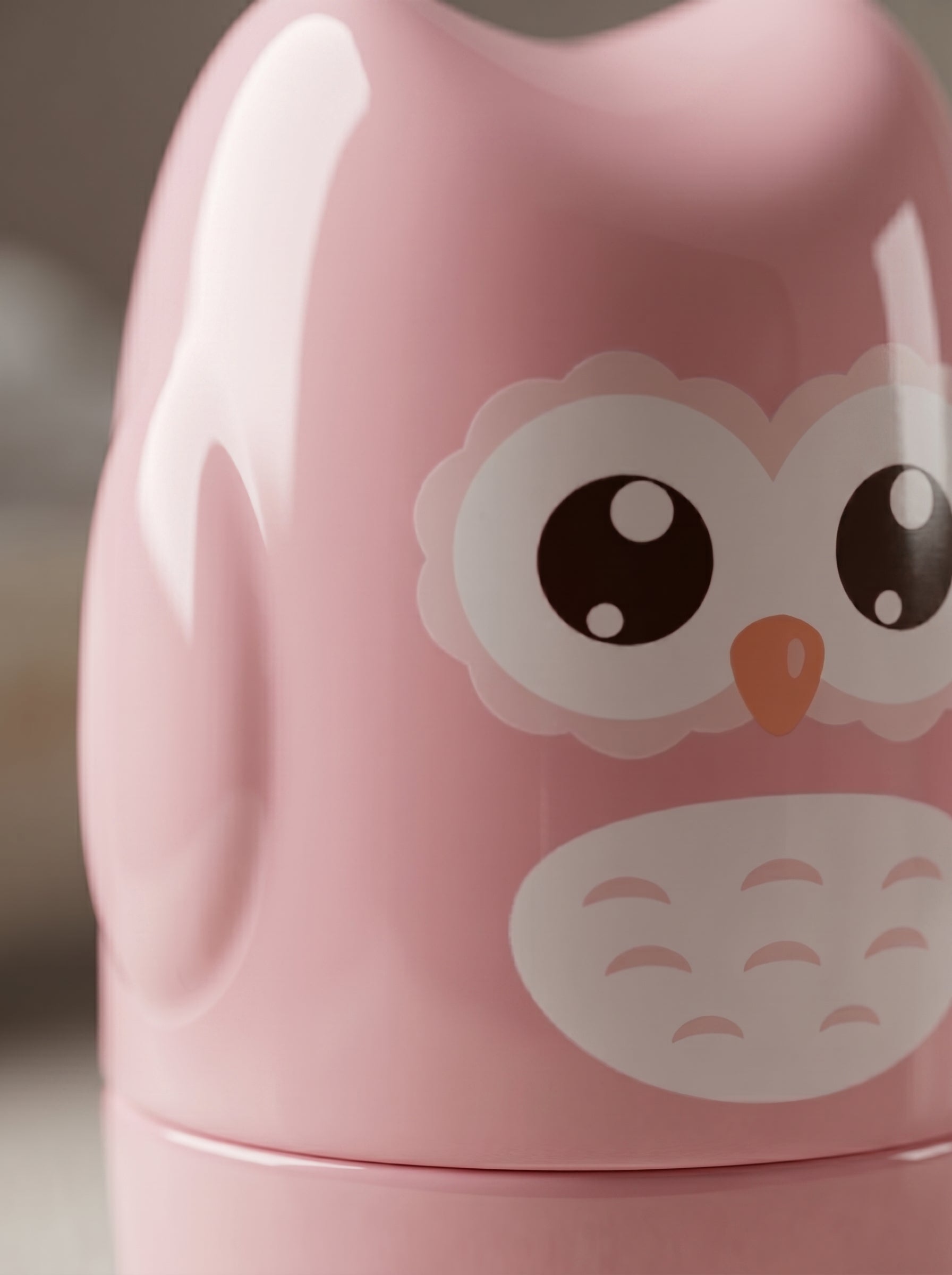 WhisperCare™ baby care kit in a pink owl-shaped case with large eyes and a white belly design.