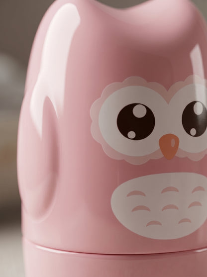 WhisperCare™ baby care kit in a pink owl-shaped case with large eyes and a white belly design.