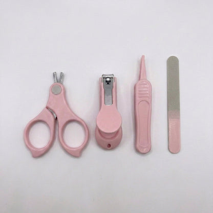 A pink pet grooming kit with four tools: nail clippers, a nail file, a small brush, and a nail trimmer, arranged on a plain white background.
