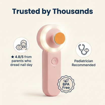 Pink plastic handheld nail trimmer with a round glowing light and orange filing pad. BPA Free label shown.